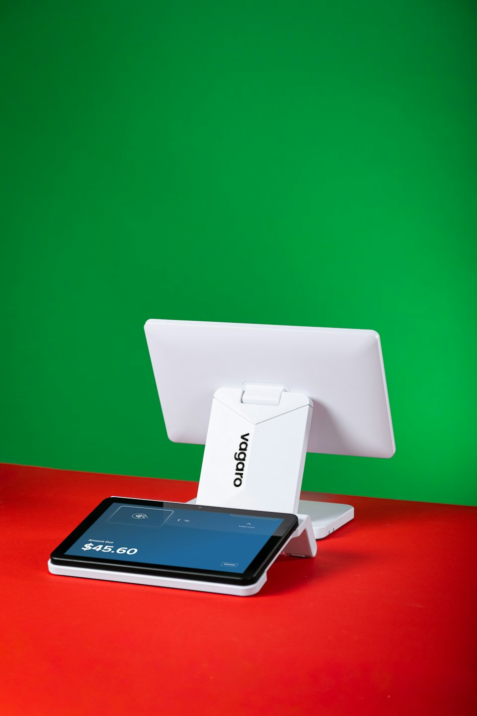 A white point of sale system displays transaction screens.