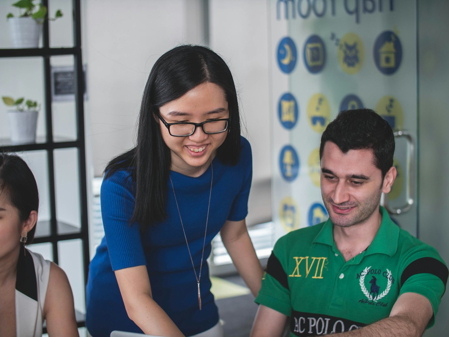 Professionals collaborating in a bright, modern office space.